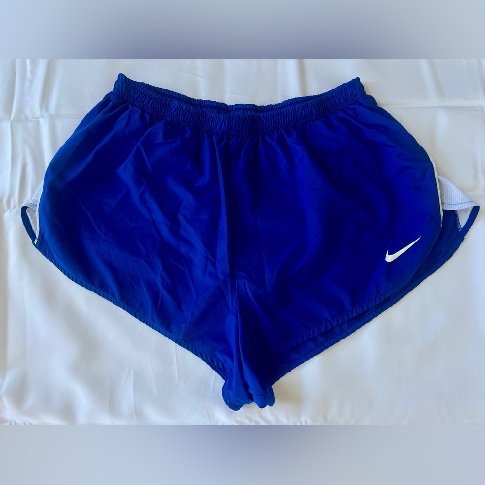 Blue Nike running shorts